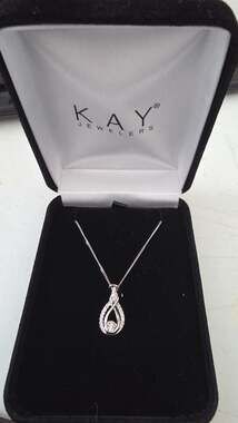 Interwoven .925 Sterling Silver Diamond Infinity Twist Pendant Necklace
